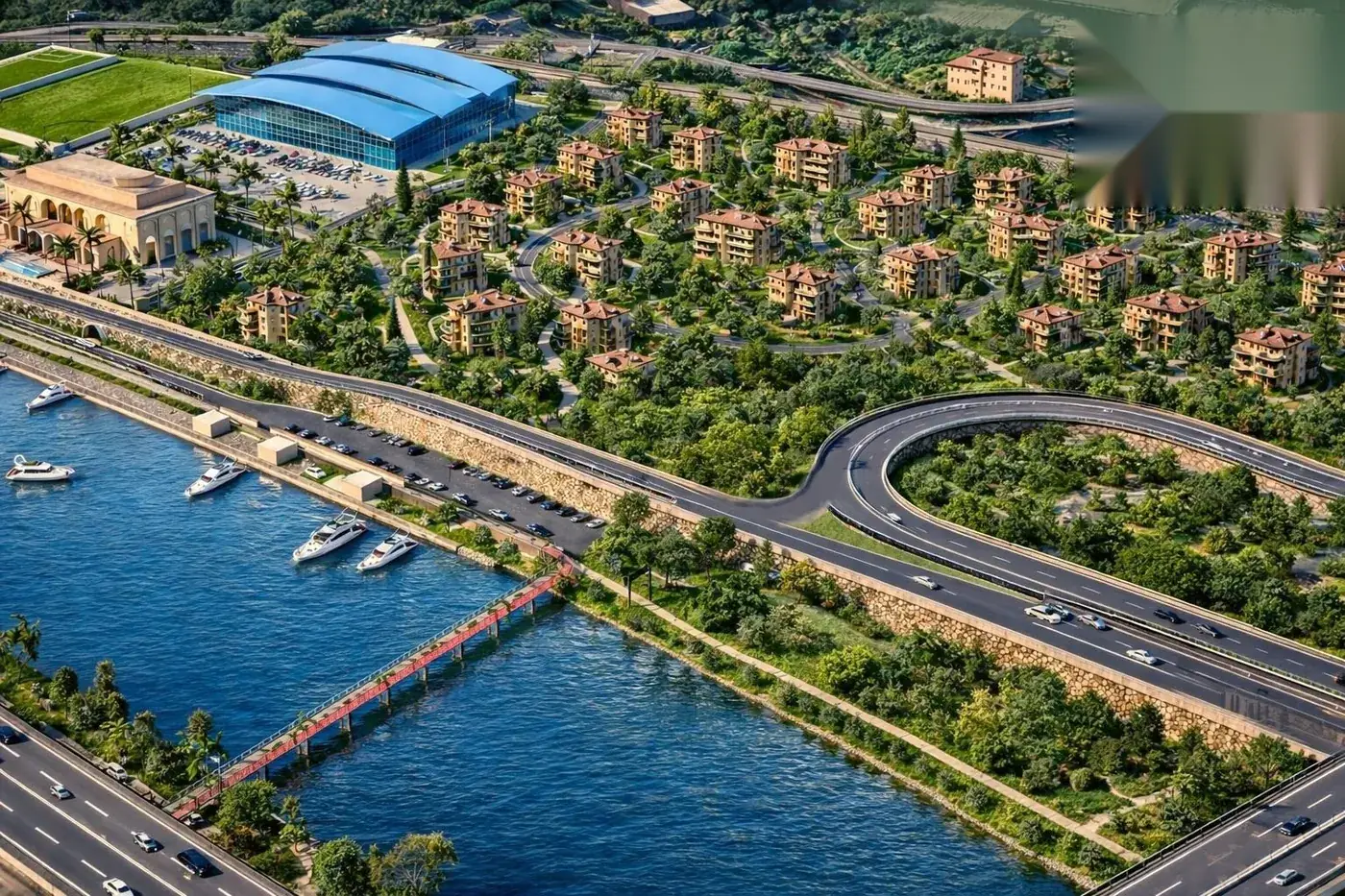 Vue aérienne du plan d’eau aménagé : marina, pont et front de mer du district
